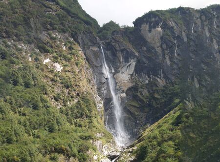 Beautiful hill and small village in the mountain valley of Nepal, this village surrounded by high mountainの写真素材