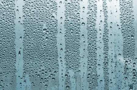 Water drops on the glass. Background of water drops on the window.の写真素材