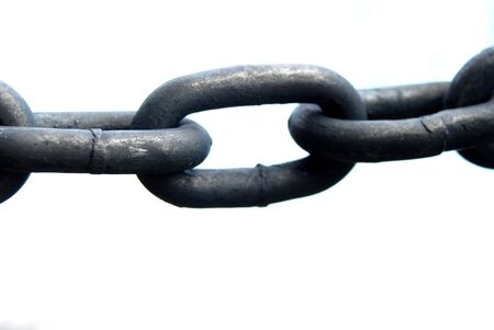 Detail of a iron chain with white background.