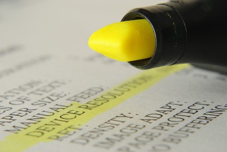 Yellow Highlighter and technical words on a paperの写真素材