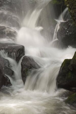 A beautiful waterfall with soft water shot with long exposure.の写真素材