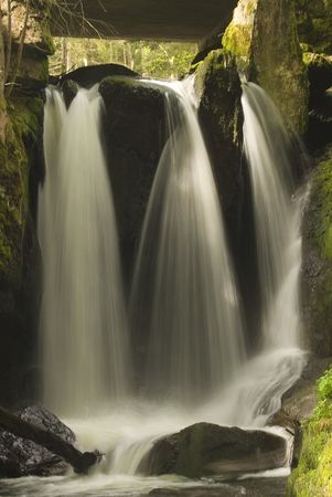 A beautiful waterfall with soft water shot with long exposure.の写真素材