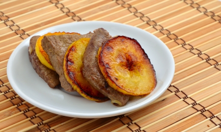 Fried veal liver and applesの写真素材