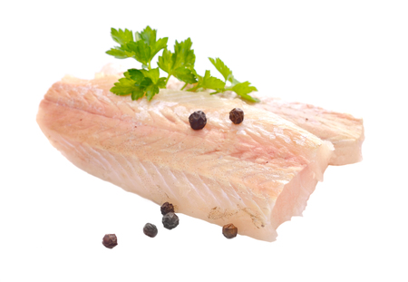 Raw Hake fish fillet pieces. Isolated on white background.の写真素材