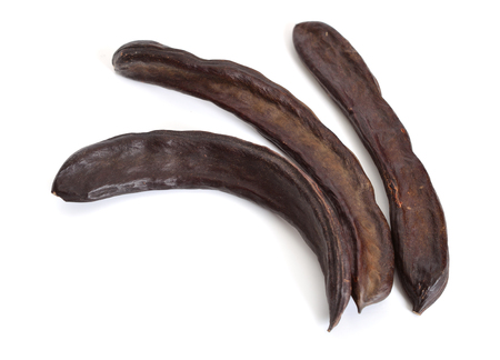 Carob pods isolated on white background. の写真素材