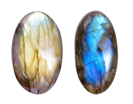 Two Polished blue labradorite Caboshons. Isolated on white background.