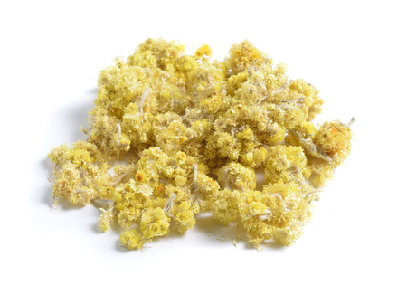 Dried medicinal herbs raw materials isolated on white. Flowers Helichrysum arenarium is also known as dwarf everlast, and as immortelleの写真素材