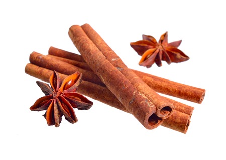 Dried bark of Cinnamomum cassia with star anise. Isolated on white background.の写真素材