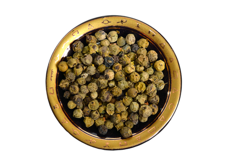 Green peppercorns or Schinus terebinthifolius. Isolated on white background.の写真素材