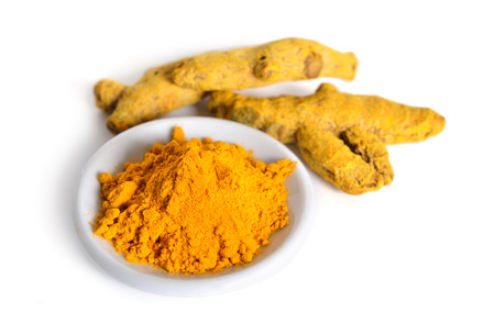 Roots and powder of curcuma. Isolated on white background.
