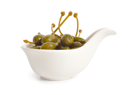 Pickled caper berries isolated on white background.の写真素材