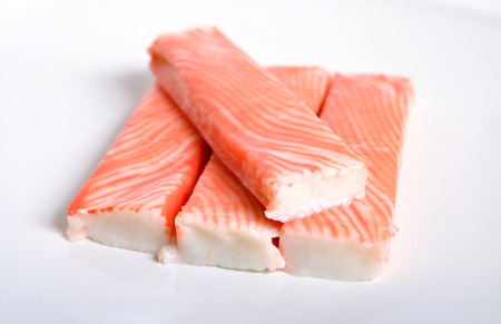 Crab sticks, krab sticks, imitation crab meat or seafood sticks. Isolated on white.の写真素材