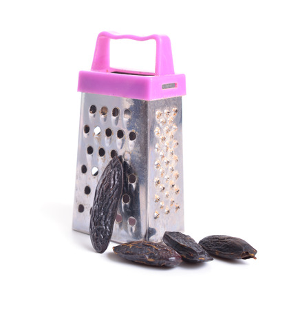 Dried tonka beans with little Grater. isolated on white backgroundの写真素材