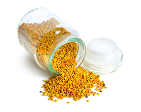 Bee pollen baskets in the glass jar. isolated on white background,の写真素材