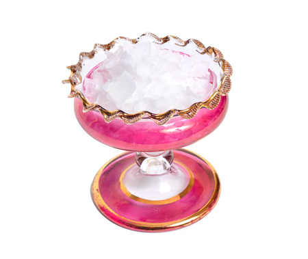 Pyramidal salt from Cyprus. Flakes in wintage glass bowl. isolated.の写真素材