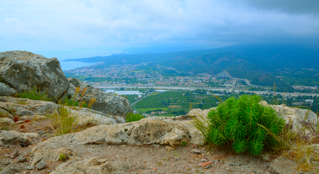 Mountain view to Camyuva or Chamyoova, is a small town in the district of Kemer, Antalya Province, Turkey. On a cloudy day.の写真素材