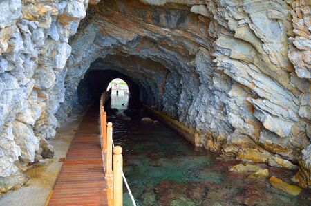 Sea tunnel in a mountain. Turunc Terench Marmaris, Mugla.の写真素材
