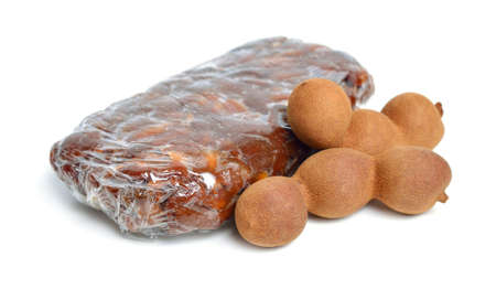 Briquette of ripe Peeled tamarind isolated on white baclgroundの写真素材