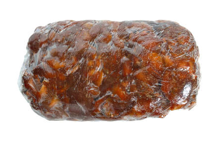 Briquette of ripe Peeled tamarind isolated on white baclgroundの写真素材