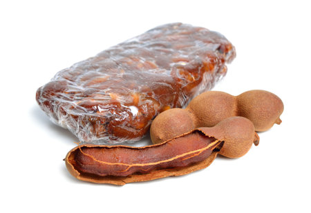 Briquette of ripe Peeled tamarind isolated on white baclgroundの写真素材
