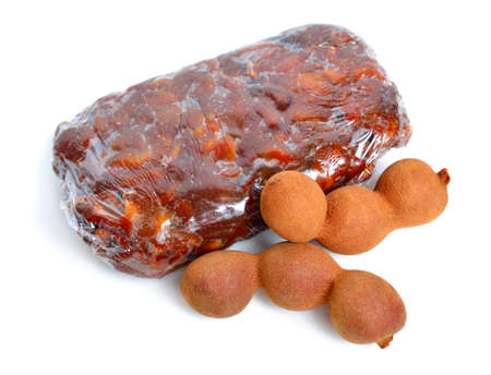 Briquette of ripe Peeled tamarind isolated on white baclgroundの写真素材