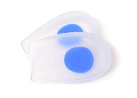 A pair of orthopedic silicone insoles isolated on white.の写真素材