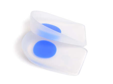 A pair of orthopedic silicone insoles isolated on white.の写真素材