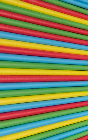 Macro shot of coloured straws lined up causing an optical illusion.の写真素材
