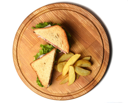 Sandwich with baked potatoes on a wooden board isolated on white background. Restaurated food. Fast food.の写真素材