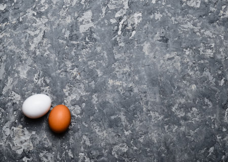 Two eggs on a concrete surface. Natural food. Top view.の写真素材