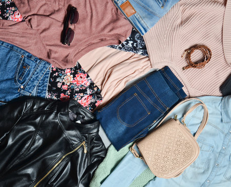 Trend clothes and accessories. Top view of many different women's clothing layout. Second hand. Casual Style.の写真素材