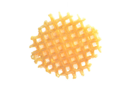 Round homemade waffle isolated on white background.の写真素材
