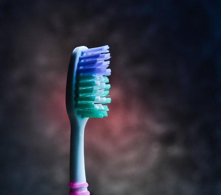 Toothbrush background of a dark concrete wall. Care of teeth.の写真素材