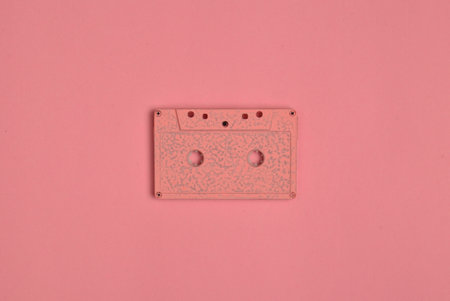 Minimalistic trend of audio technology from the 80s. Audio cassette on pastel color background.の写真素材