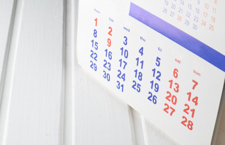 Calendar on a white wooden table.の写真素材
