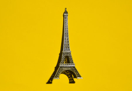 Souvenir figurine of a sefael tower on a yellow background. Top view.の写真素材