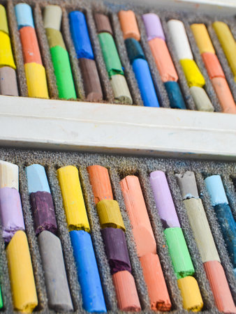 Chalk pastel stick in container box close upの写真素材