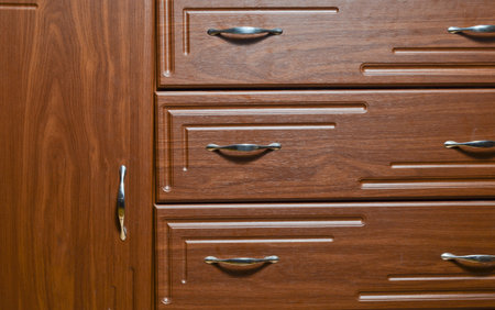 Texture of the door of a wooden bedside table