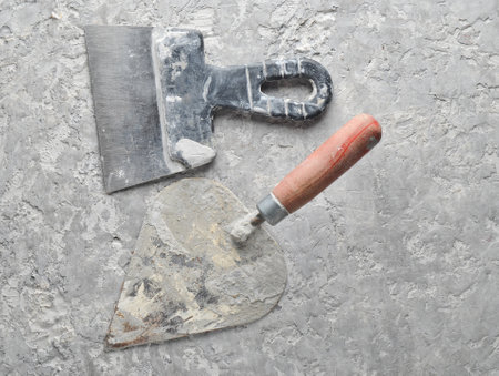 Building tools on a gray concrete background. Spatula, trowel, top viewの写真素材