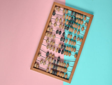 Retro wooden abacus on pastel color paper background. top viewの写真素材