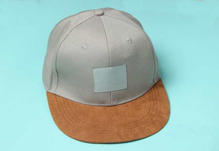 Rapper man's cap on a blue pastel backgroundの写真素材