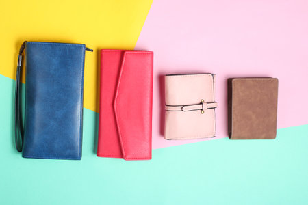 Many leather purses on a colored pastel background. Top Viewの写真素材