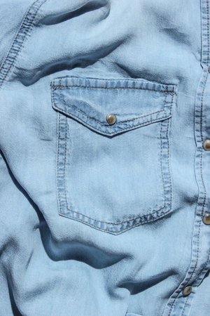 Pocket blue denim shirtの写真素材
