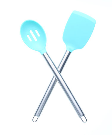 Silicone spatulas for cooking with metal handles isolated on white background. Top view.の写真素材
