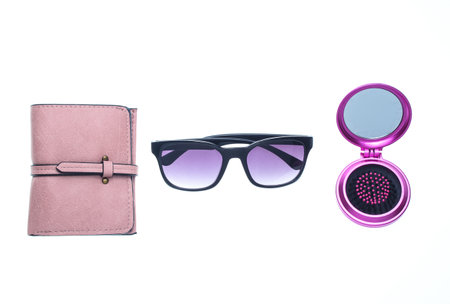 Leather wallet, sunglasses, mini hairbrush-pocket mirror isolated on white backgroundの写真素材