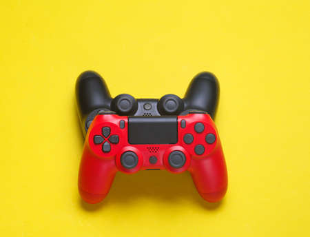 Two joysticks on a yellow background. top viewの写真素材
