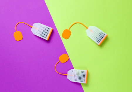 Three silicone tea bags on a colored background. Top view, minimalismの写真素材