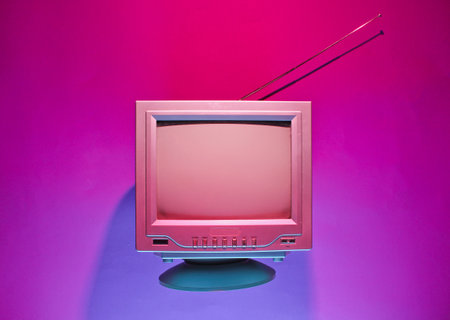 Retro wave, 80s concept. Old tv with antenna, neon light. Night television. Top view, flat layの写真素材