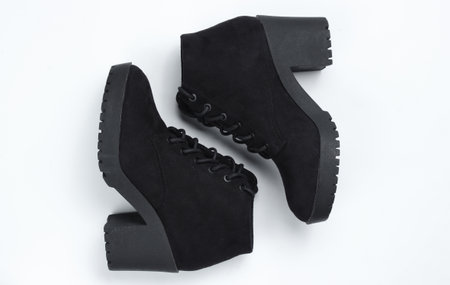 Black suede shoes on a white background. Top view, minimalismの写真素材