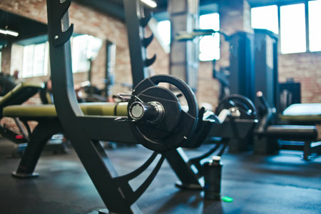 Gym equipment. Dark Gym with barbells on rack. Fitness workout center. Sport concept.の写真素材
